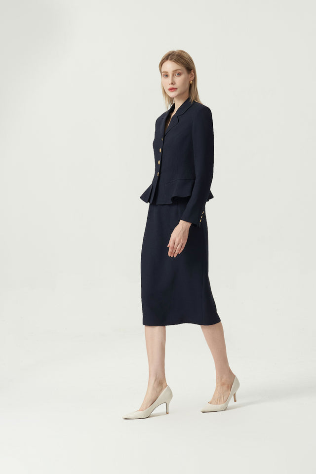Hopkins Skirt in Navy on model, side styling view showing the straight silhouette