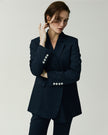 Kew Blazer in Navy, closer up front view showing the double-breasted closure and notched lapels