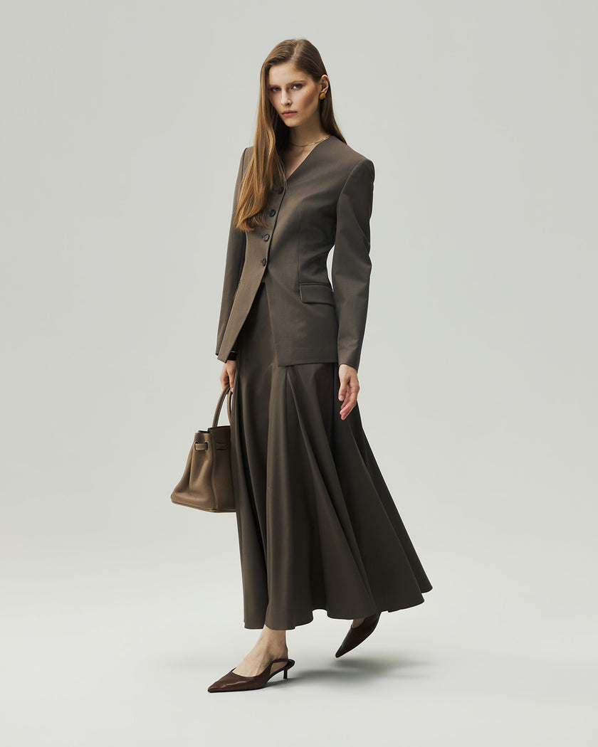 Sculpted Midi Skirt in Warm Tea Brown on model, three-quarter styling view showing the full silhouette