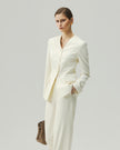 Vanilla sculpted jacket on model, three-quarter view highlighting the four-button front