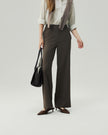 Warm Tea Brown straight-leg trousers on model, lower-body view showing the high-rise waist and clean leg