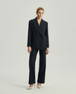 Kai charcoal grey double-breasted blazer styled with matching tailored trousers