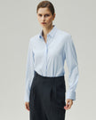 Sky Blue tailored shirt on model, front view showing the pointed collar and fitted waist