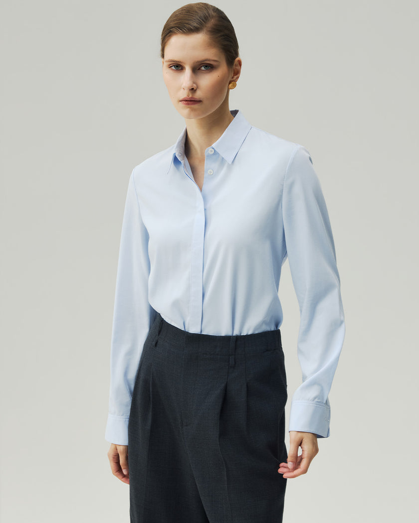 Sky Blue tailored shirt on model, front view showing the pointed collar and fitted waist