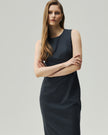 Grey pinstripe dress, close-up view showing the round neckline and sculpted waist