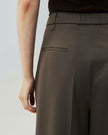 Warm Tea Brown wide-leg trousers, close-up showing the high-rise waist 