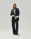 Charcoal Grey wide-leg trousers on model, full-length front view showing the high-rise waist and relaxed leg