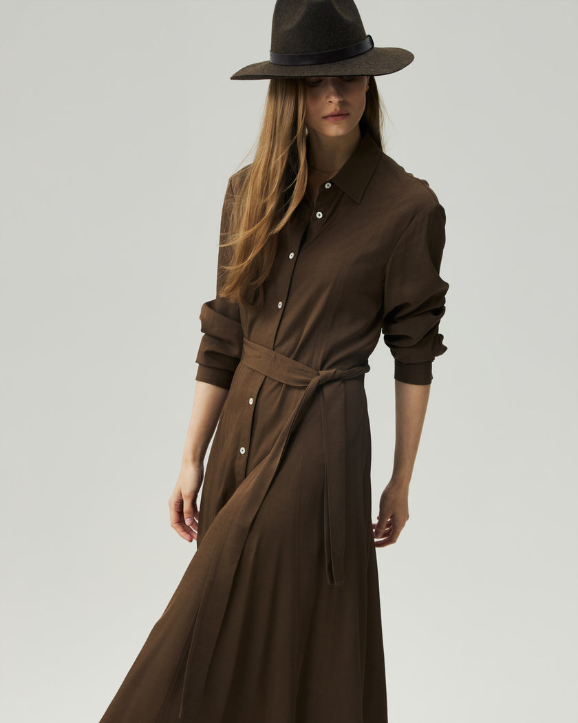 Oak Moss shirt dress on model, three-quarter view highlighting the self-fabric belt and fluid drape