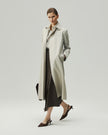 Oatmeal Beige trench coat on model, full-length side view showing the relaxed silhouette