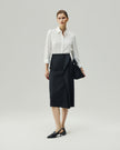 Asymmetric Skirt in Charcoal Grey on model, full-length front styling view