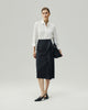 Asymmetric Skirt in Charcoal Grey on model, full-length front styling view