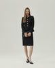 Berkeley Jacket in Black, front view showing the collarless round neckline and fitted waist
