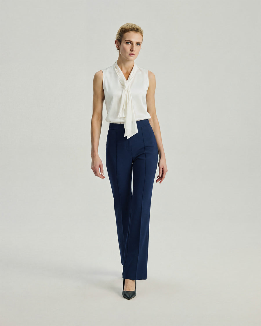 Gandi Trousers in Navy on model, full-length front styling view