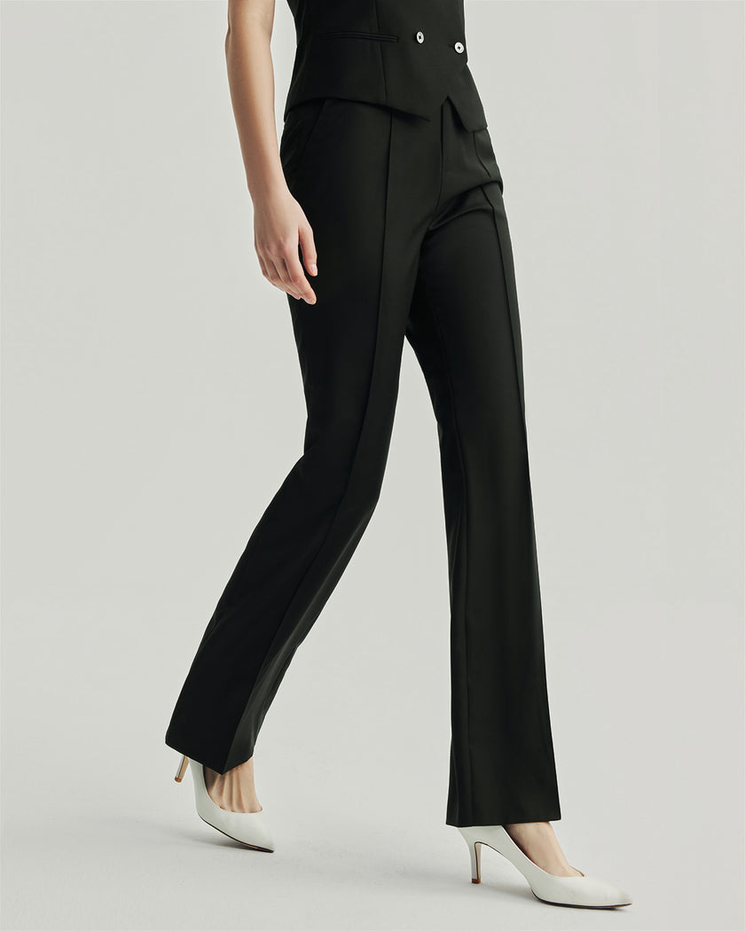 Black Gandi Trousers on model, lower-body walking view showing the straight-leg silhouette