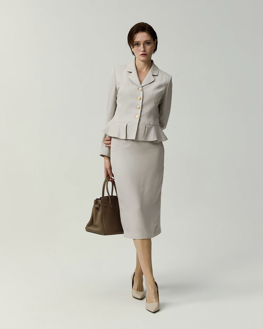 Leiden Jacket in Almond on model, full-length front view styled with a matching skirt