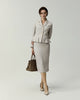 Leiden Jacket in Almond on model, full-length front view styled with a matching skirt