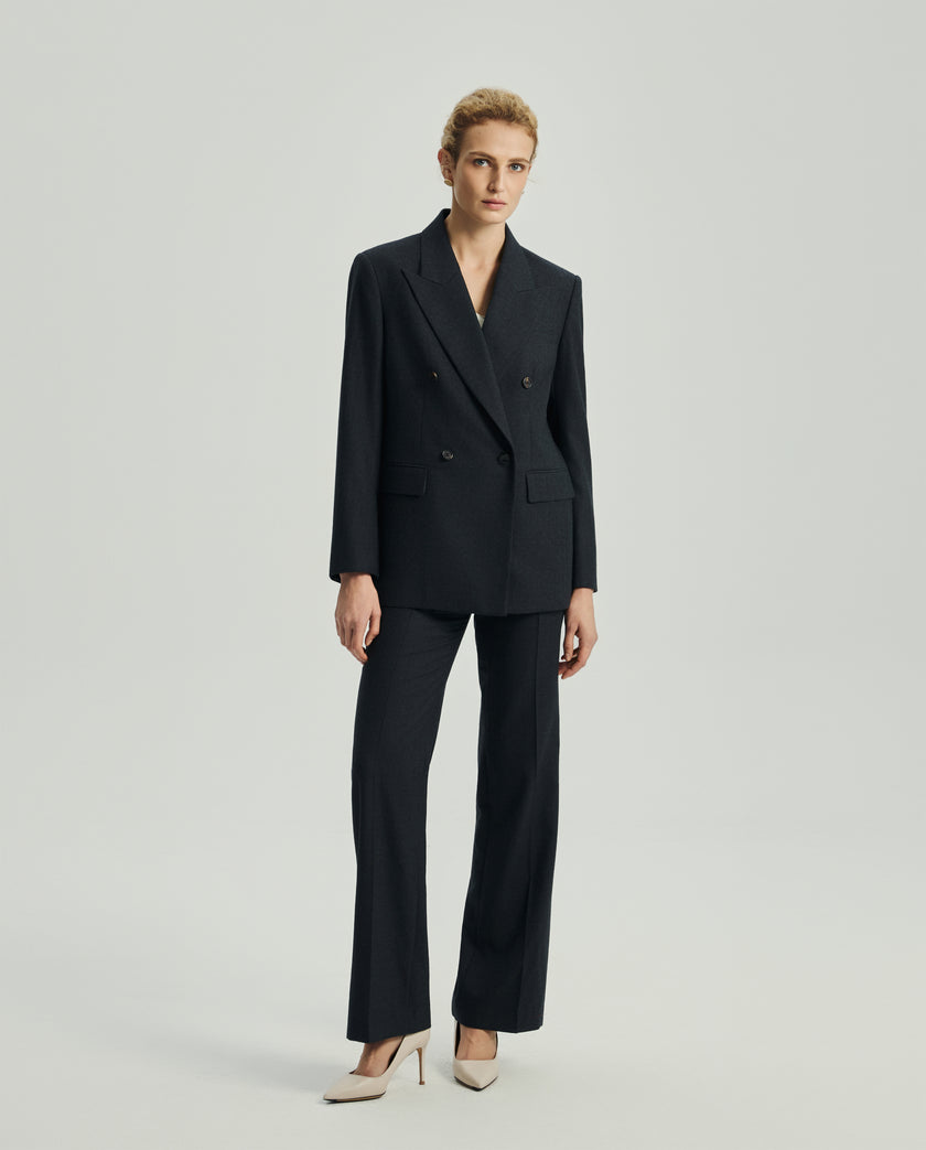 Ecole charcoal grey high-rise trousers styled with a matching tailored blazer