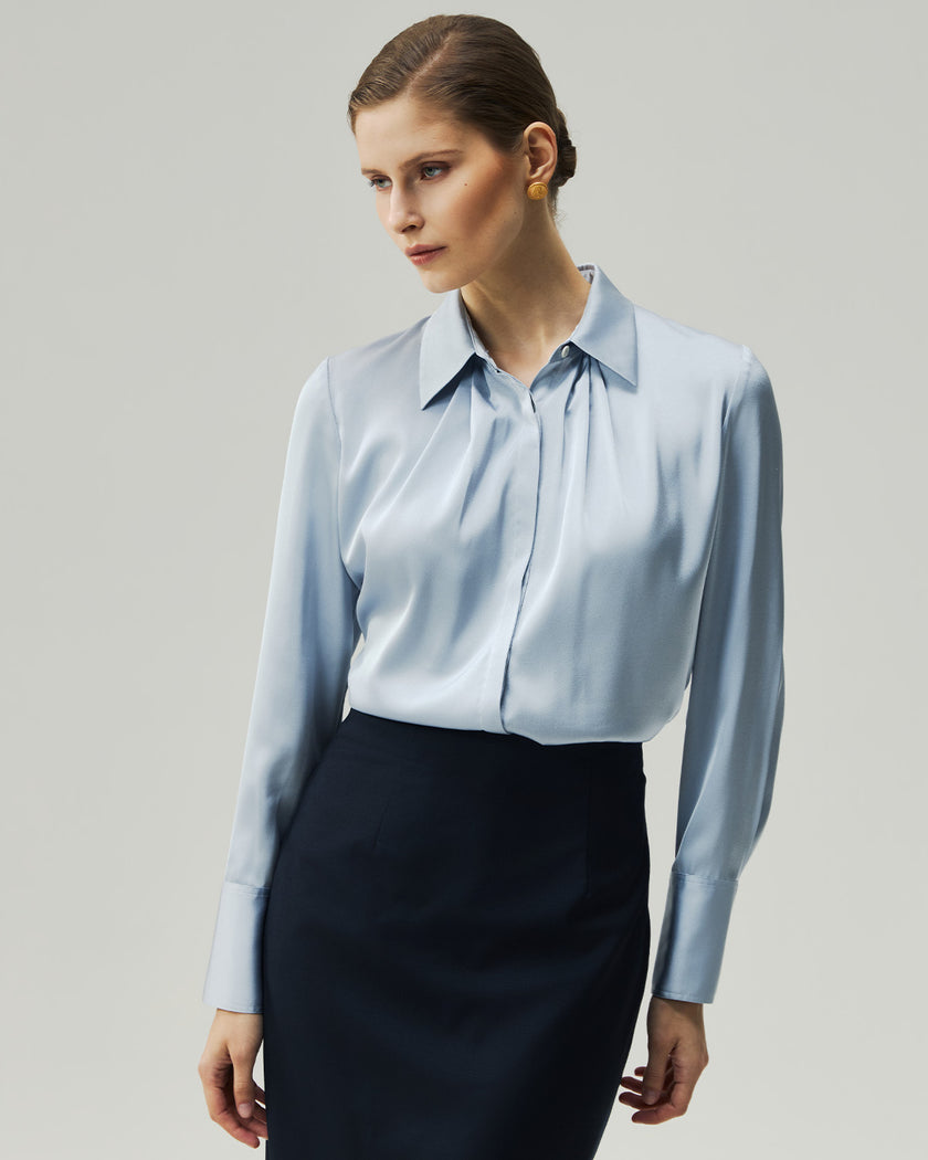 Glacier Blue blouse on model, front view showing the square neckline and long sleeves