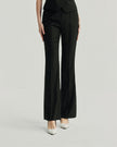 Gandi Trousers in Black, lower-body front view highlighting the pressed center creases and slim tailored fit