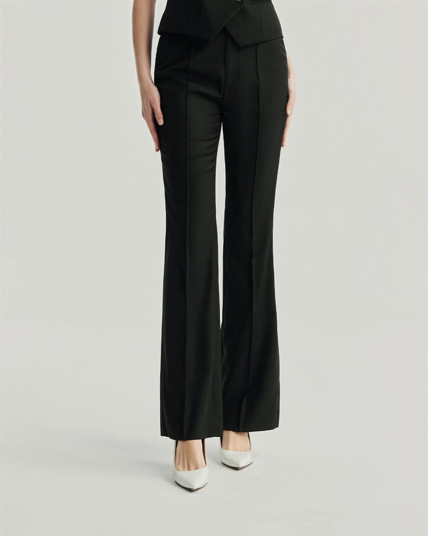 Gandi Trousers in Black, lower-body front view highlighting the pressed center creases and slim tailored fit