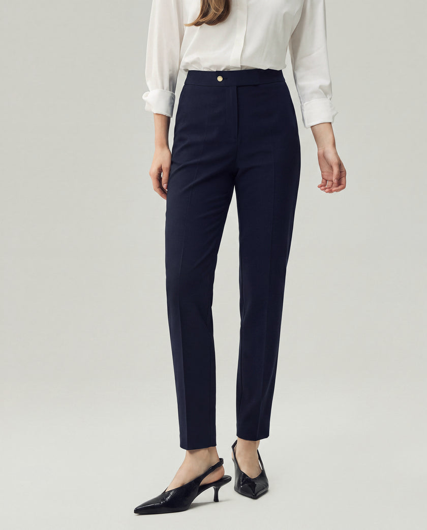 Dark Navy Check Elena Trousers on model, lower-body front view showing the high-rise waist and slim straight leg