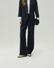 Charcoal Grey straight-leg trousers on model, lower-body view showing the high-rise waist and clean leg