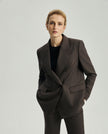 Front view of the Kai blazer in ebony featuring peak lapels and horn buttons