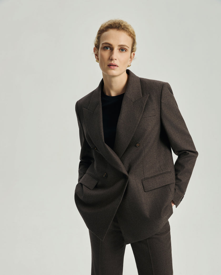 Front view of the Kai blazer in ebony featuring peak lapels and horn buttons