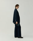 Navy Kew Blazer on model, side view showing the slim tailored silhouette, styled with matching trousers