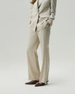 Oatmeal Check straight-leg trousers on model, showing the high-rise waist and clean leg