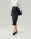 Asymmetric Skirt in Charcoal Grey on model, highlighting the wrap overlay