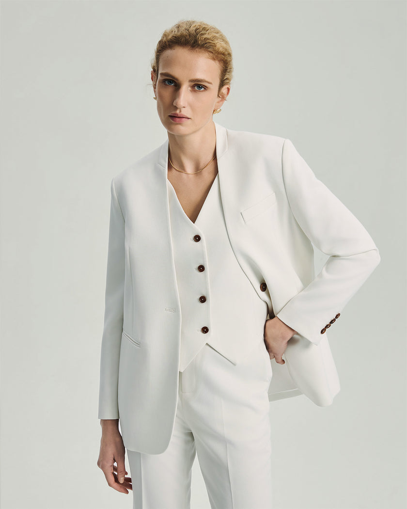 White Wells Blazer on model, front view showing the collarless outer jacket and V-neck inner vest