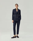 Dark Navy Check Elena Trousers on model, full-length front view with coordinated tailored blazer