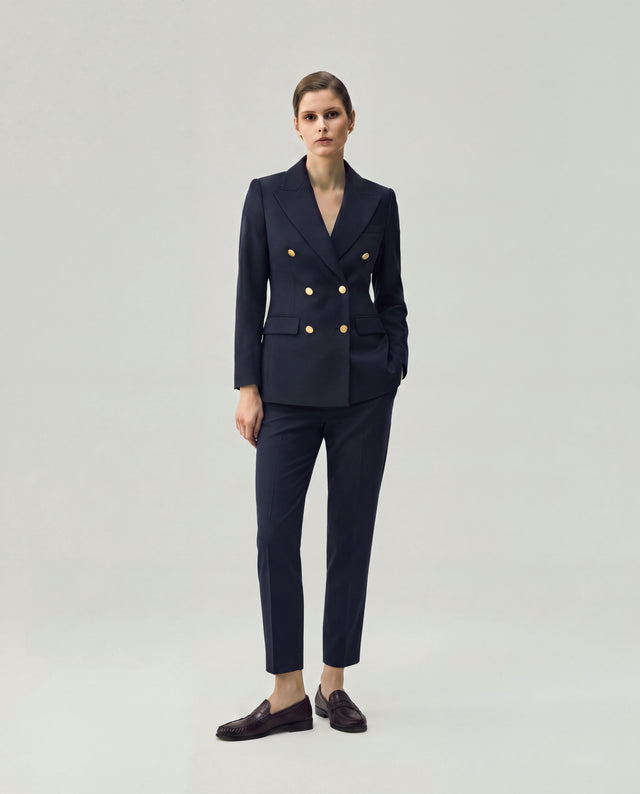 Dark Navy Check Elena Trousers on model, full-length front view with coordinated tailored blazer