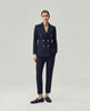 Dark Navy Check Elena Trousers on model, full-length front view with coordinated tailored blazer