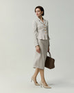 Almond Leiden Jacket on model, full-length front view with matching skirt 