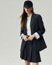 Mini Skirt in Charcoal Grey styled with a blazer, three-quarter view on model