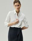 Tailored Shirt in Classic White, highlighting the fitted waist and long sleeves