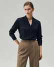 Deep Navy Riva Shirt on model, front view showing the V neckline and softly relaxed drape
