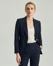 Dom Blazer in Dark Navy Check, highlighting the peak lapels and sculpted waist