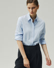 Tailored Shirt in Sky Blue, highlighting the shaped waist and long sleeves