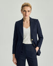 Dark Navy Check Dom Blazer on model, front view showing the structured shoulders and gold-tone buttons