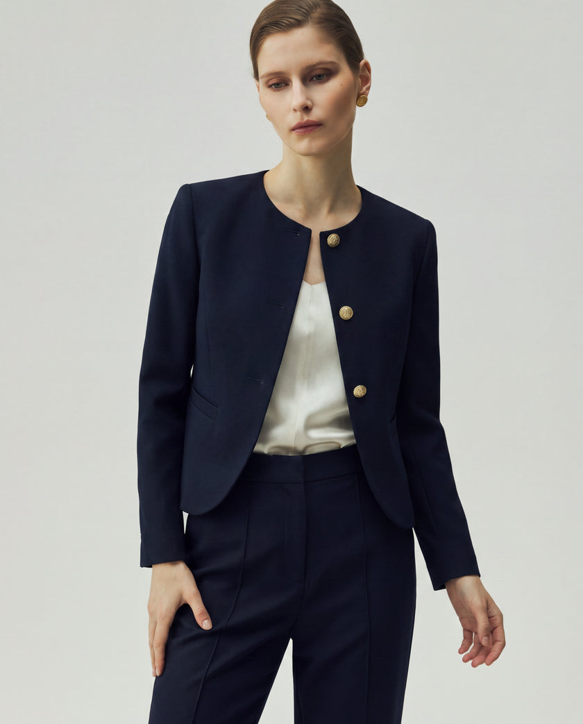 Textured Navy Gabri Jacket, close-up showing the fitted silhouette and gold-tone button front