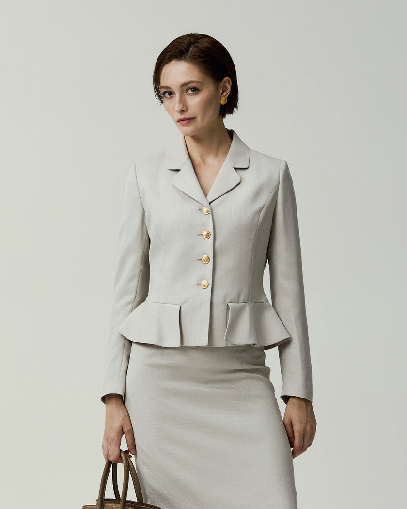 Almond Leiden Jacket on model, front view showing the cropped silhouette and four-button closure