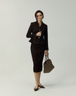 Leiden Jacket in Deep Chocolate styled with a matching skirt, full-length front view