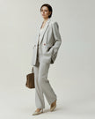 Kew Blazer in Almond on model, side view showing the slim tailored silhouette
