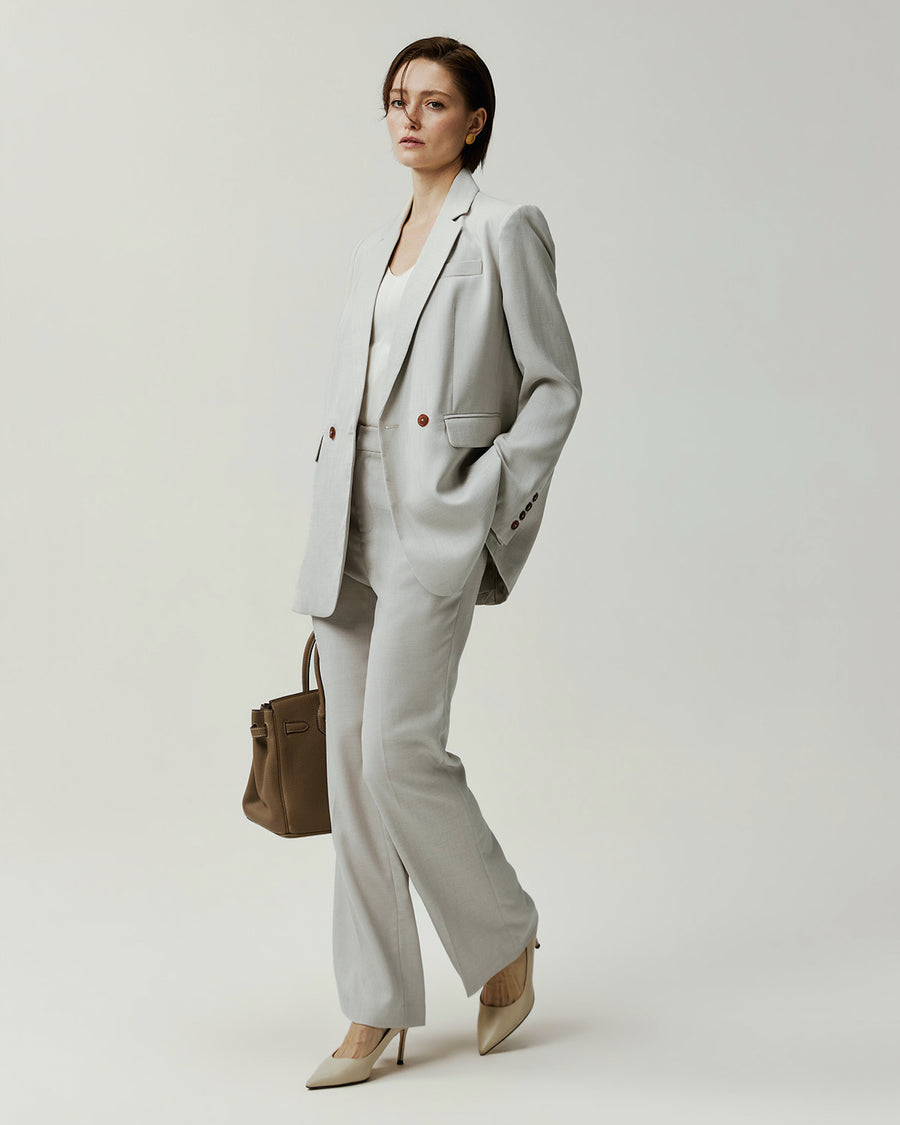 Kew Blazer in Almond on model, side view showing the slim tailored silhouette