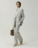 Kew Blazer in Almond on model, side view showing the slim tailored silhouette