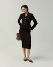 Deep Chocolate Hopkins Skirt on model, three-quarter styling view with matching tailoring
