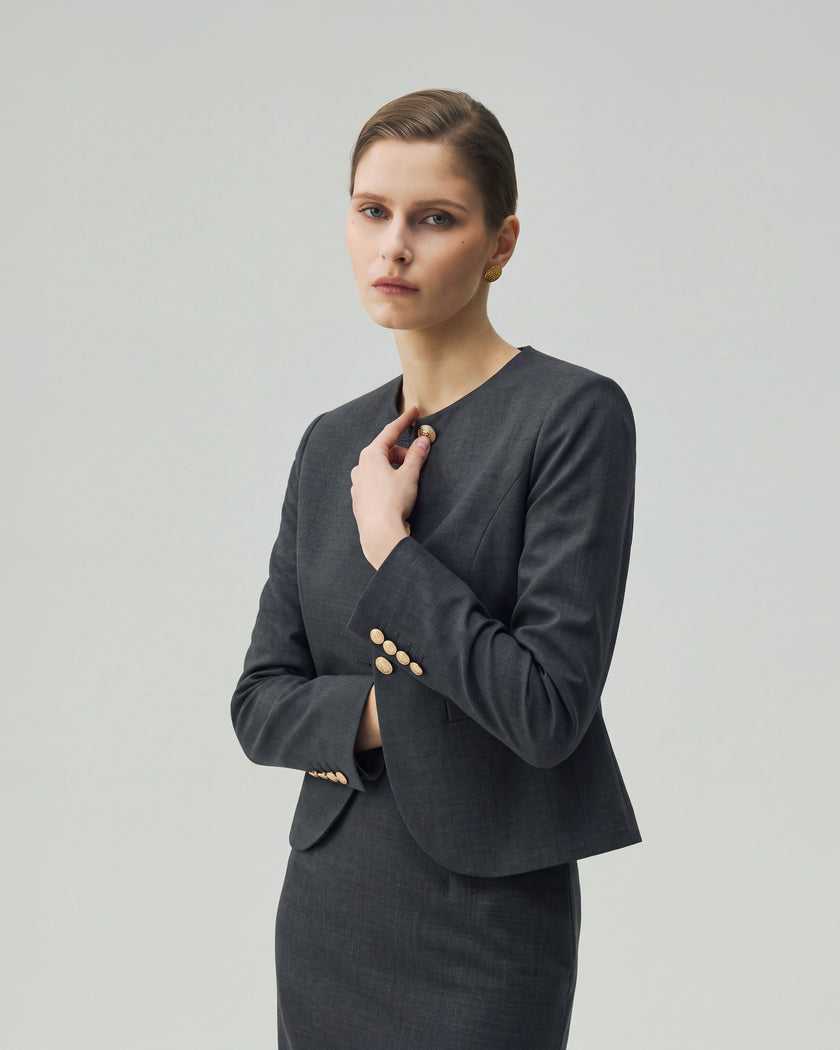 Model wearing the Gabri charcoal grey jacket showing its cropped fit and curved hem